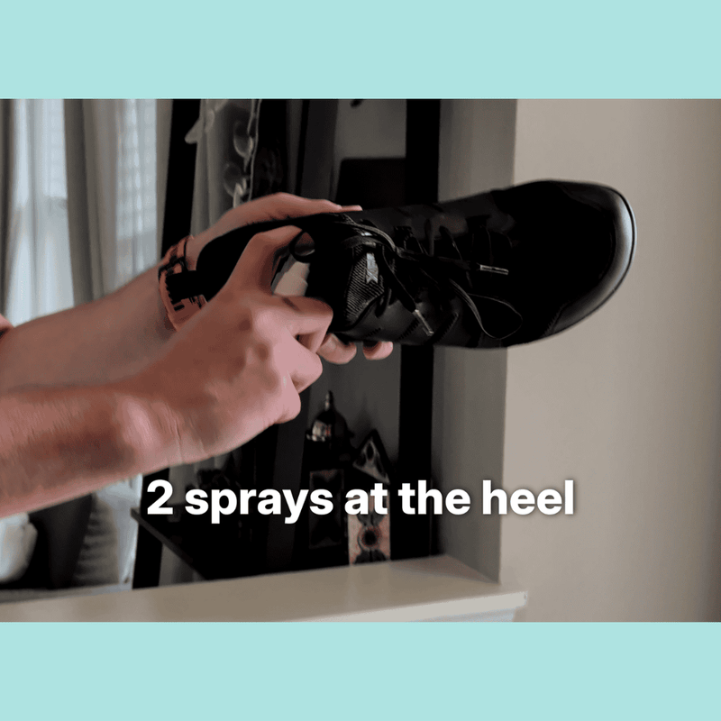 Spraying MyFootology shoe spray into the heel area of a shoe