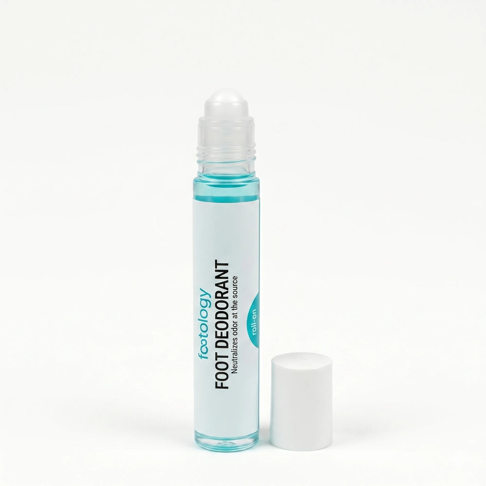 footology Foot Deodorant Roll-On with cap removed showing the rollerball applicator. Slim glass bottle and white screw cap on white background