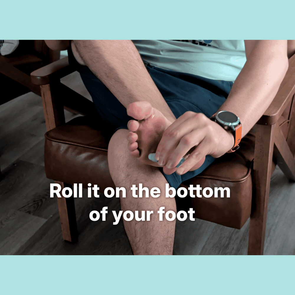 Applying MyFootology roll-on foot deodorant to the bottom of a foot