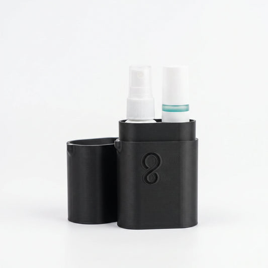 Black Footology travel case open with the foot deodorant roll-on and shoe spray inside