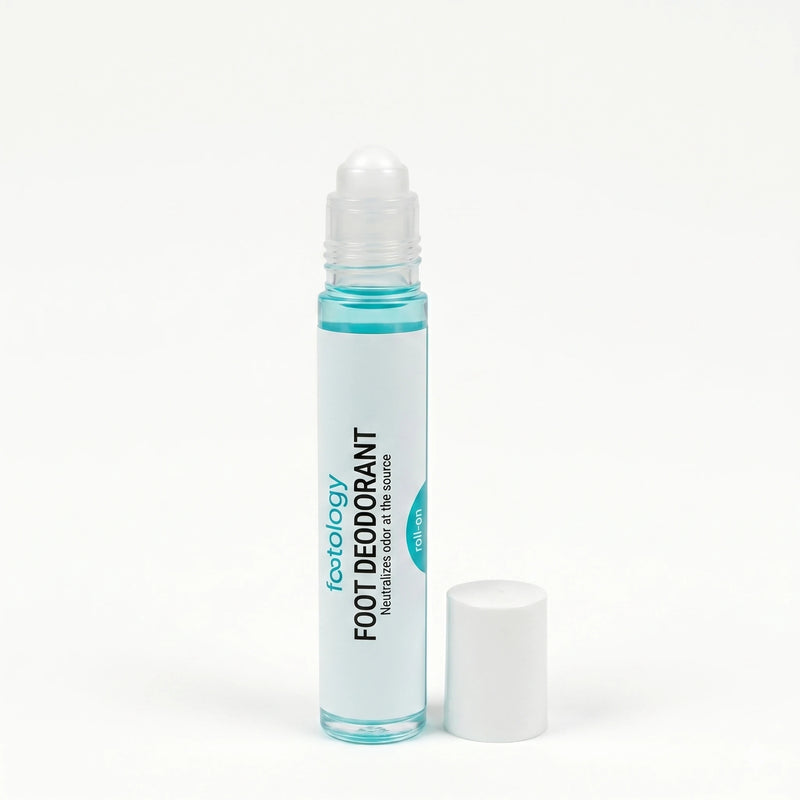 footology Foot Deodorant Roll-On with cap removed showing the rollerball applicator. Slim glass bottle and white screw cap on white background
